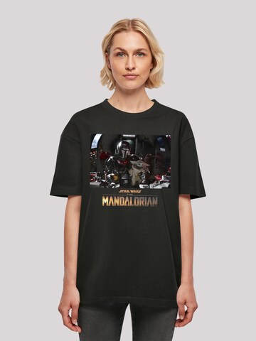F4NT4STIC Shirt 'Star Wars The Mandalorian Child On Board' in Zwart: voorkant