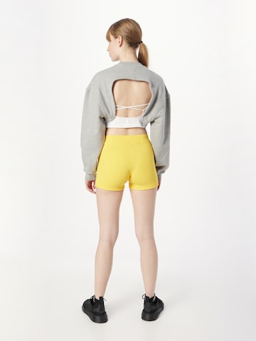 ADIDAS SPORTSWEAR Slim fit Workout Pants 'Lounge Rib Booty' in Yellow