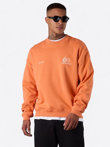 ESTEEM Sweatshirt 'Opposé' in Orange: front