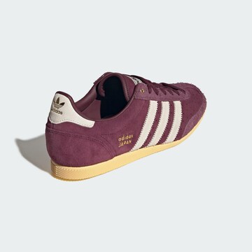 Baskets basses ADIDAS ORIGINALS en rouge