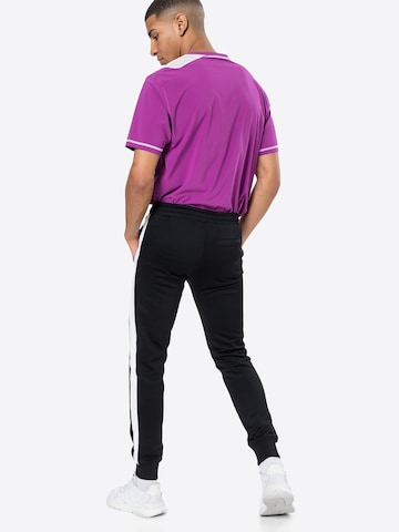 PUMA - Tapered Pantalón en negro