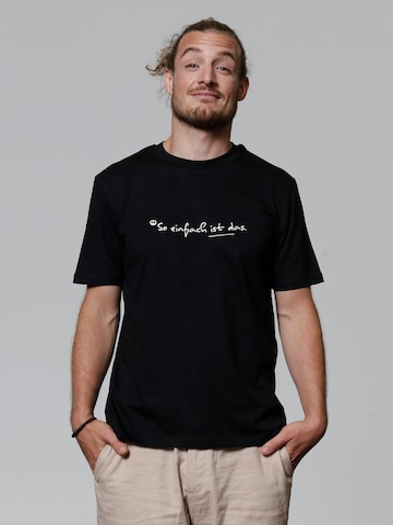 T-Shirt 'So Einfach Ist Das' Watapparel en noir : devant