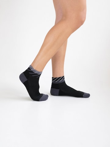 INCYLENCE Athletic Socks 'DISRUPTS SHORT' in Black