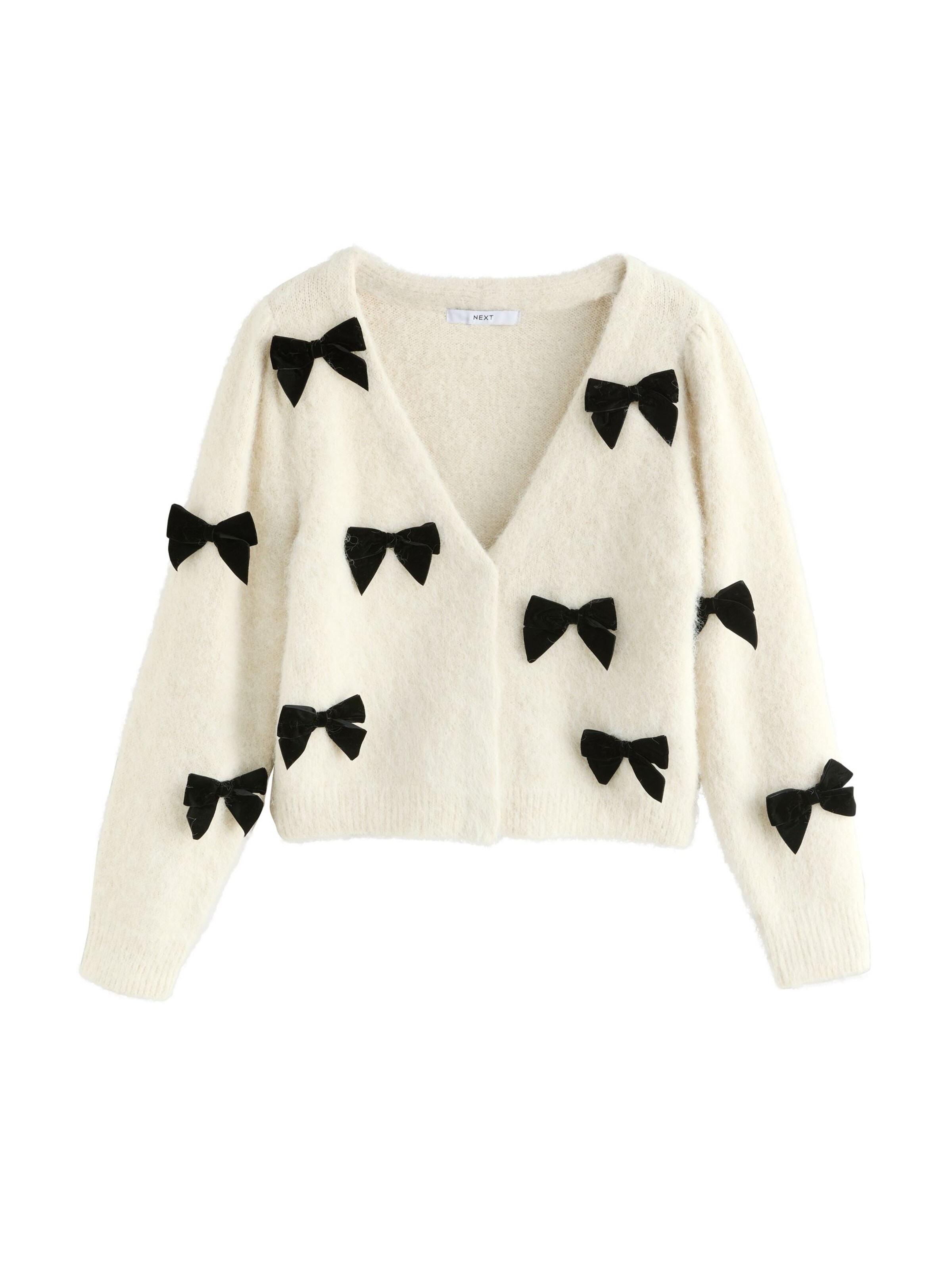 Next Kofta i beige: framsida