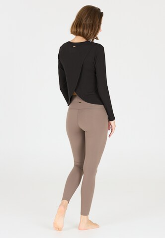 Athlecia Functioneel shirt 'Mandes' in Zwart