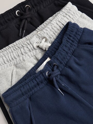 Tapered Pantaloni di Next in colori misti