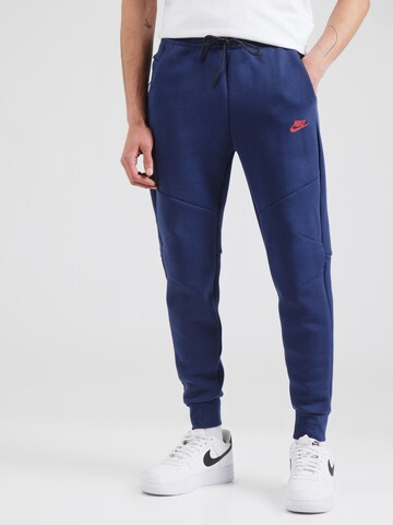 Effilé Pantalon 'TCH FLC' Nike Sportswear en bleu : devant