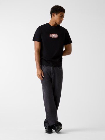 GUESS T-Shirt in Schwarz