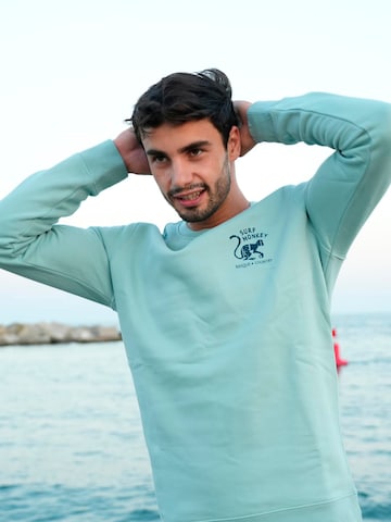 Surf Monkey Sweatshirt 'Rette das Ozean' in Blue