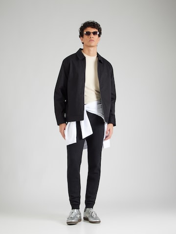 Tapered Pantaloni de la ELLESSE pe negru