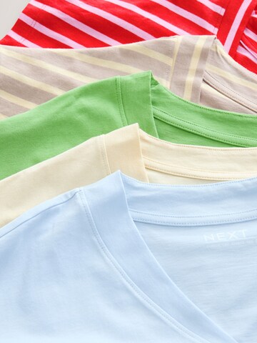 Tricou de la Next pe bej