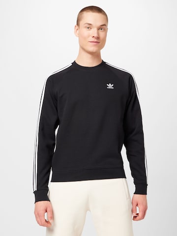 ADIDAS ORIGINALSSweater majica 'Adicolor Classics 3-Stripes' - crna boja: prednji dio
