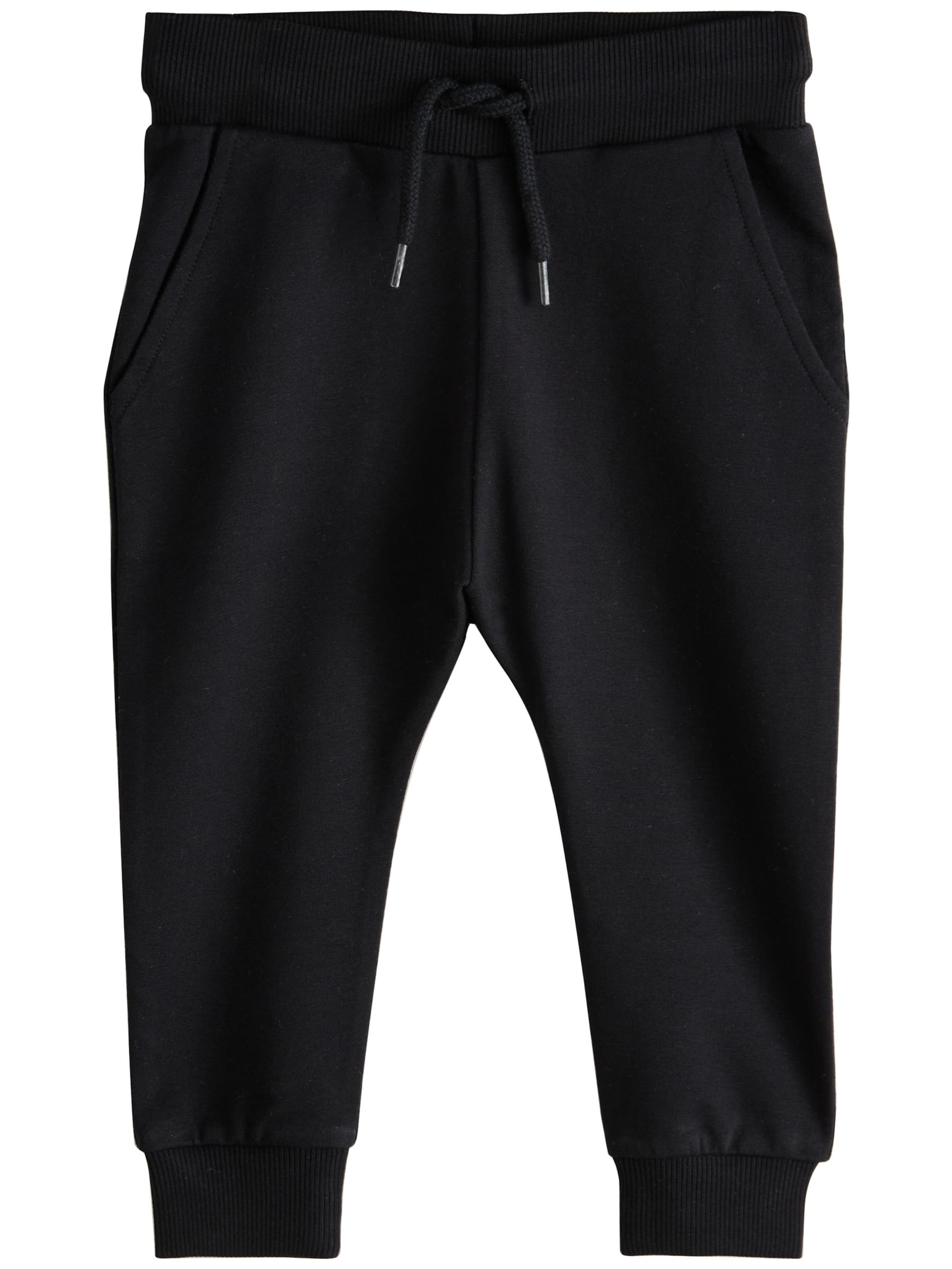 NextTapered Hlače - crna boja: prednji dio