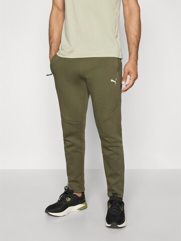 PUMA Slimfit Urheiluhousut 'Evostripe' värissä vihreä: etupuoli