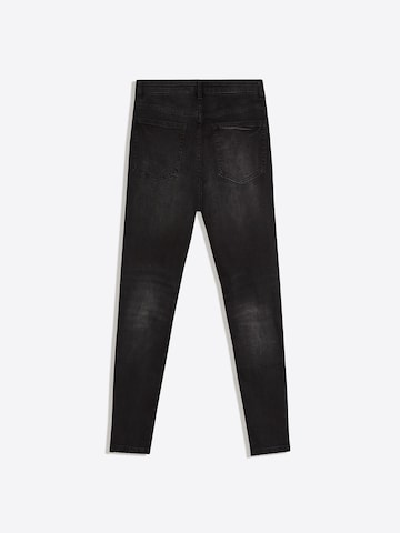 Bershka Tapered Jeans i sort