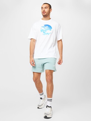 Regular Pantaloni 'Club Flow' de la Nike Sportswear pe albastru