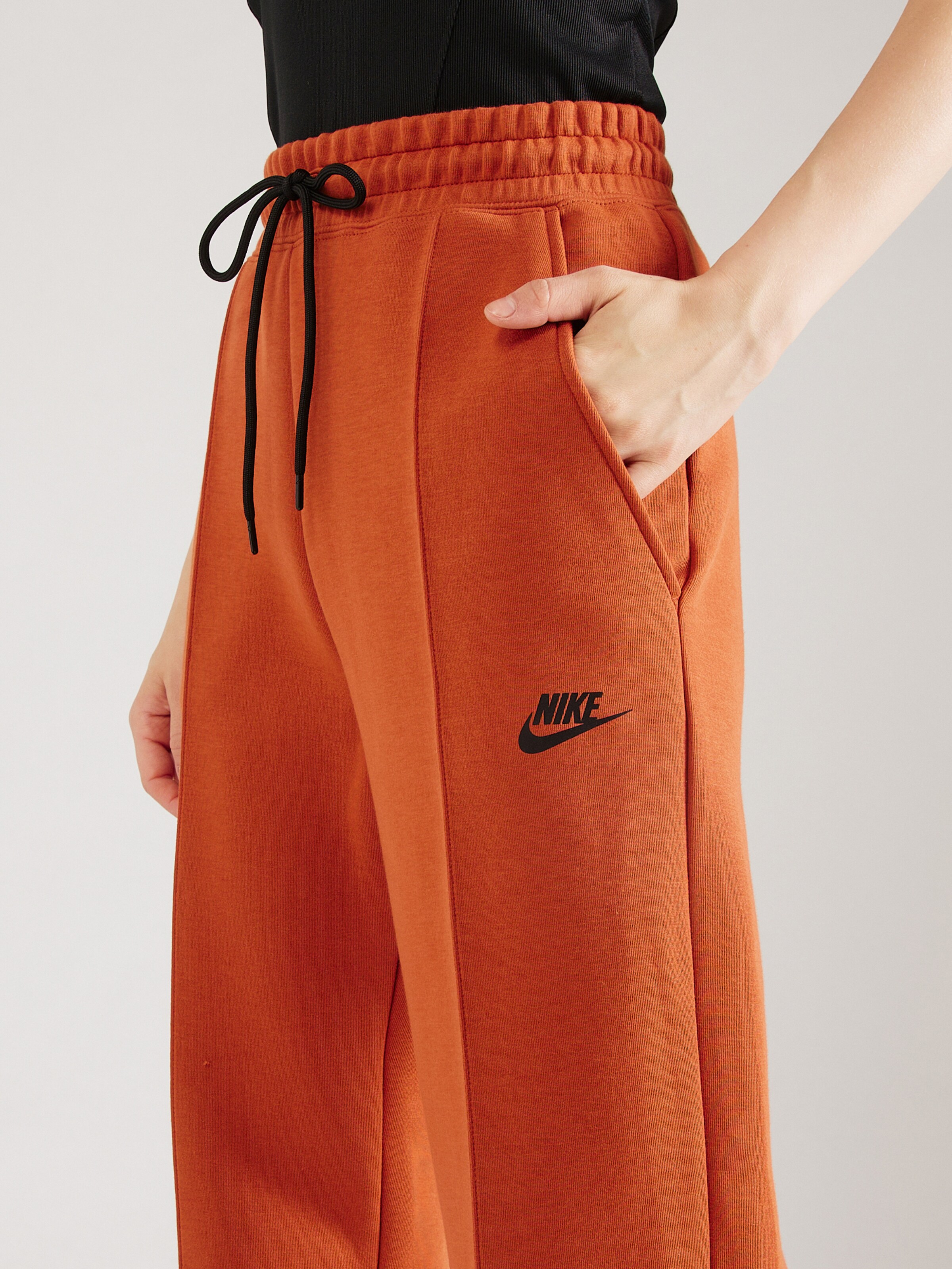 Effile Pantalon TCH FLC Nike Sportswear en Orange ABOUT YOU