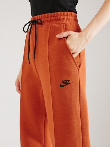 Nike Sportswear Zúžený Kalhoty 'TCH FLC' – oranžová