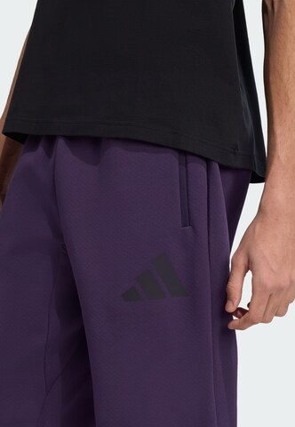 Tapered Pantaloni sportivi 'Z.N.E.' di ADIDAS SPORTSWEAR in lilla