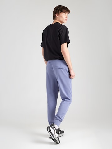 Nike Sportswear Tapered Broek 'Club Fleece' in Blauw