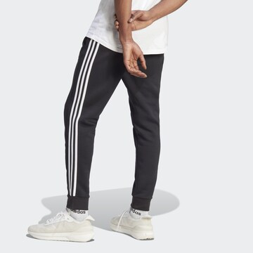 ADIDAS SPORTSWEAR Tapered Sports trousers 'Essentials' in Black