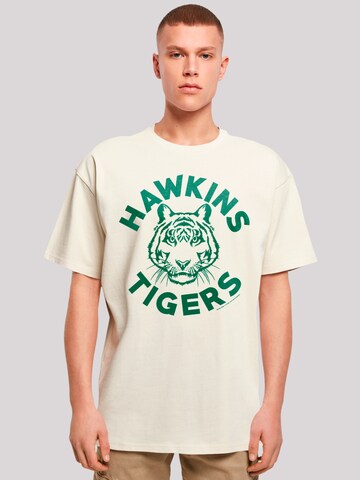 F4NT4STIC Shirt 'Stranger Things Hawkins Tigers Netflix TV Series' in Beige: voorkant