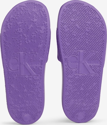 Calvin Klein Jeans Mules in Purple