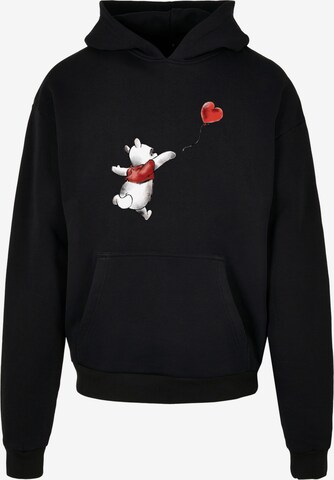 Sweat-shirt 'Disney Winnie The Pooh Winnie & Balloon' F4NT4STIC en noir : devant