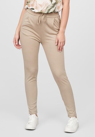 Tapered Pantaloni con pieghe di Cloud5ive in beige: frontale