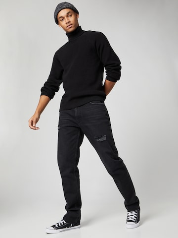 Kosta Williams x About You Regular Jeans in Black
