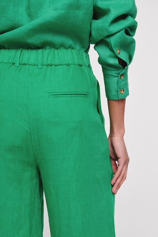 Aligne Zvonové kalhoty Kalhoty se sklady v pase 'Hainault ' – zelená