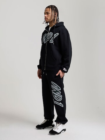 AND1 Конический (Tapered) Штаны 'Staple Graphic' в Черный