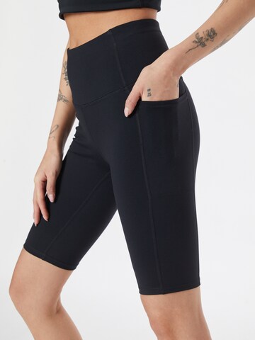 Skinny Pantalon de sport SKECHERS en noir