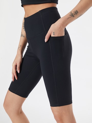 SKECHERS Skinny Sportbroek in Zwart