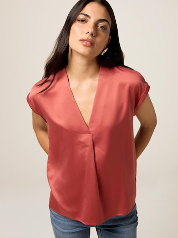 Top di oltre in rosa