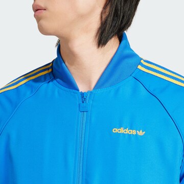 ADIDAS ORIGINALS - Sudadera con cremallera en azul