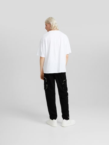 Bershka Дънки Tapered Leg Карго панталон в черно