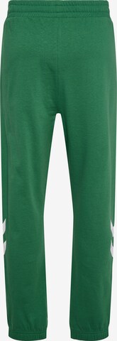 Hummel Zwężany krój Spodnie sportowe w kolorze zielony