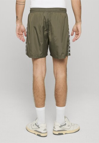 Loosefit Pantaloni di Unfair Athletics in verde