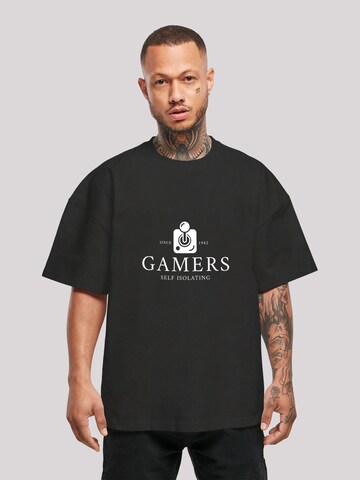 F4NT4STIC Shirt 'Gamers Self Isolating Since 1982 Retro Gaming Konsole PC Videospiele Spruch SEVENSQUARED' in Zwart: voorkant