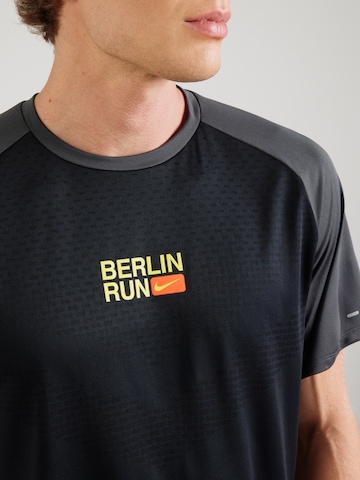 NIKE Функциональная футболка 'CITY' в Черный