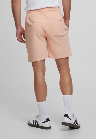 Urban Classics Loose fit Trousers in Orange