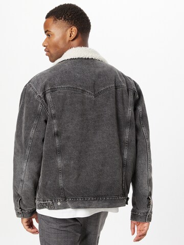 LEVI'S ® Between-Season Jacket 'Levi's® Men's Silver Tab™ Sherpa Trucker Jacket' in Black