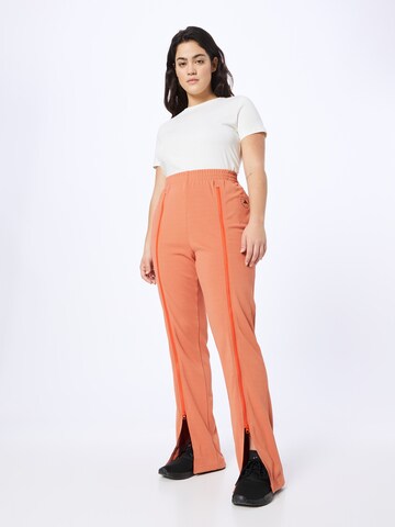 Flared Pantaloni sportivi 'Truecasuals ' di ADIDAS BY STELLA MCCARTNEY in arancione