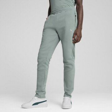 PUMA Slim fit Sports trousers 'Evostripe' in Green: front