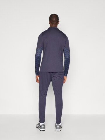 PUMA Regular Sports trousers 'Individual CUP' in Blue
