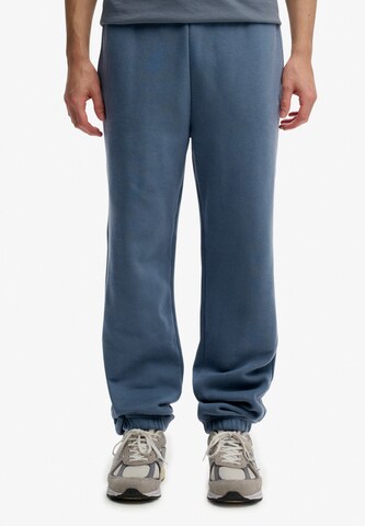 Superdry Tapered Broek in Blauw: voorkant