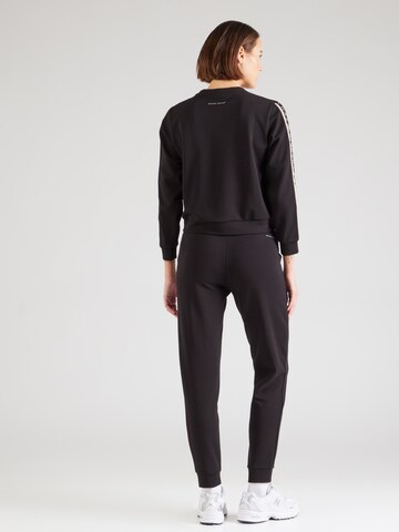 Tuta da jogging 'NATURAL VENTUS7' di EA7 Emporio Armani in nero