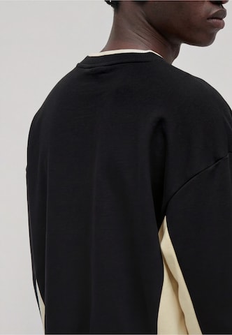 Karl Kani Bluzka sportowa 'Signature' w kolorze czarny