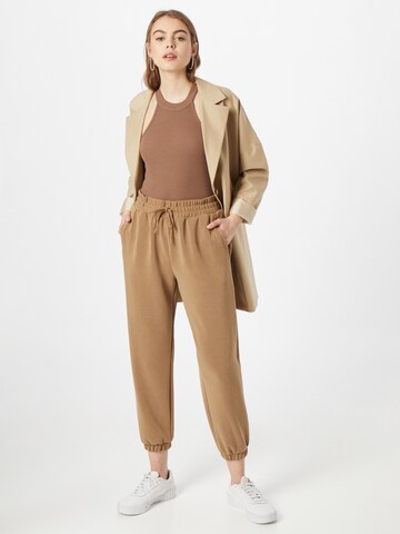 Tapered Pantaloni di s.Oliver in marrone